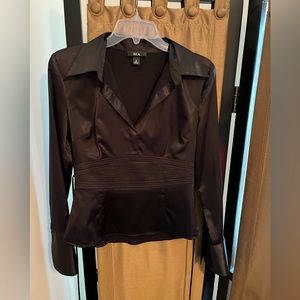 Black satin looking dressy top. 98% polyester and 2% spandex.